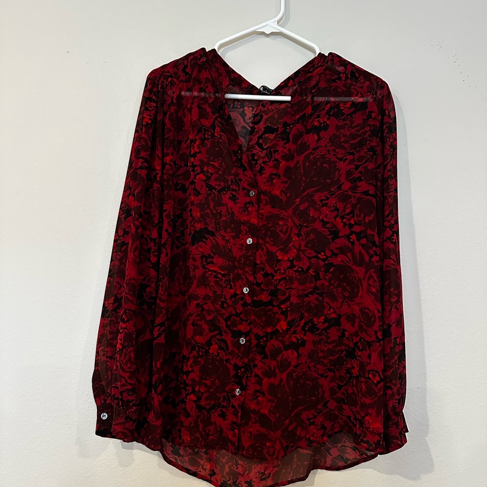 Red blouse w/black flowers size large. It is‎ sheer and buttons at the front.